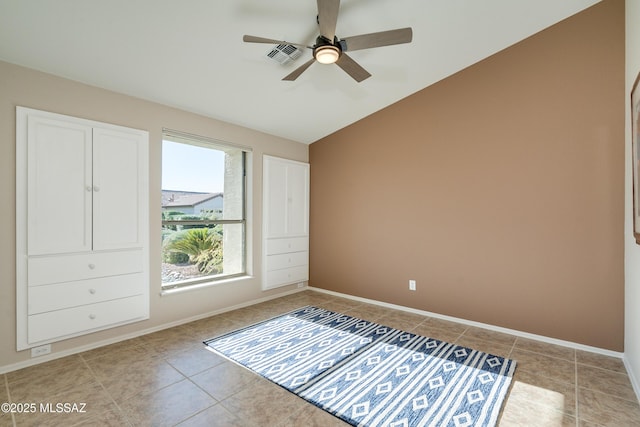 unfurnished bedroom with ceiling fan and light tile patterned floors