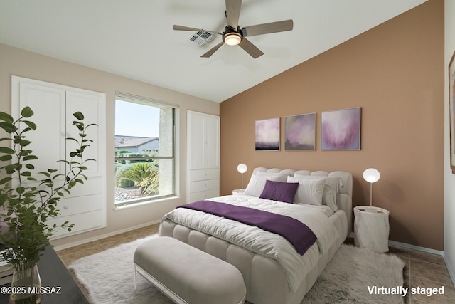 tiled bedroom featuring vaulted ceiling and ceiling fan