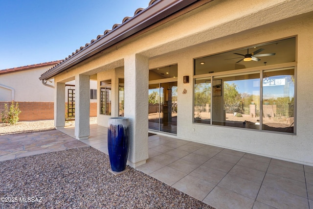 view of patio featuring ceiling fan