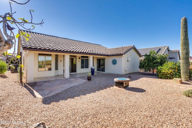 rear view of property featuring a patio area