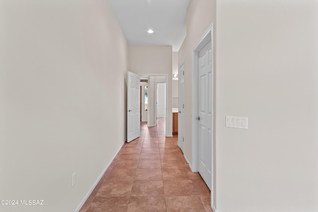 hallway with light tile patterned flooring