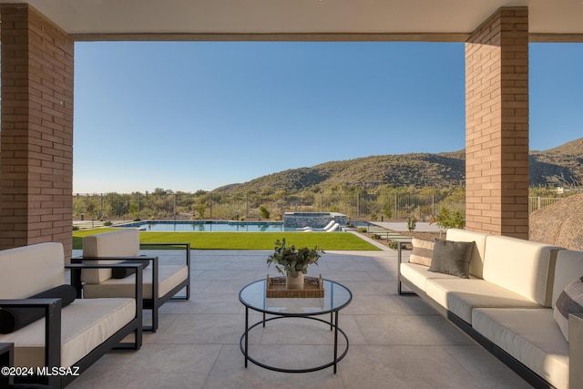 view of patio featuring a mountain view and an outdoor hangout area