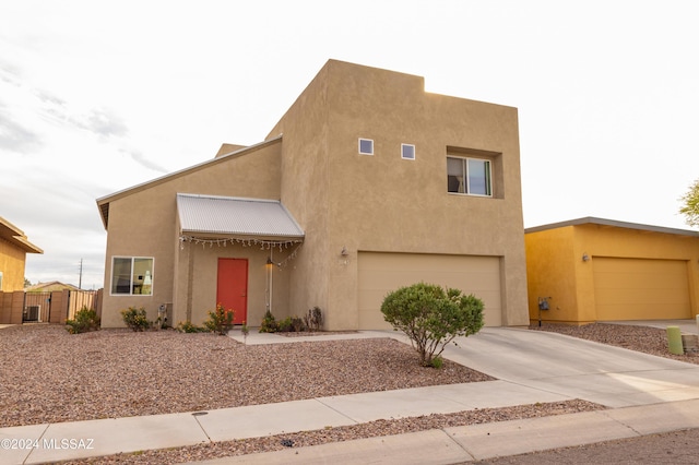 southwest-style home featuring a garage