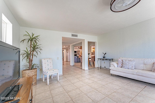 living room with light tile patterned flooring