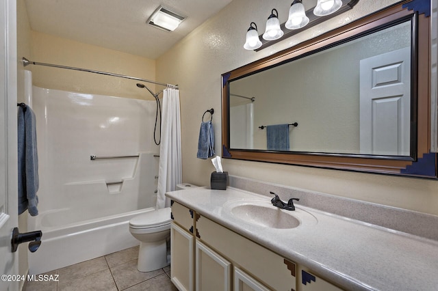 full bathroom featuring shower / bathtub combination with curtain, tile patterned floors, toilet, and vanity