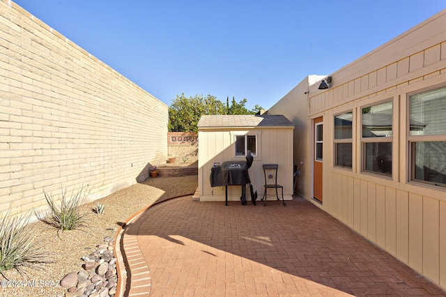 view of patio / terrace featuring a shed