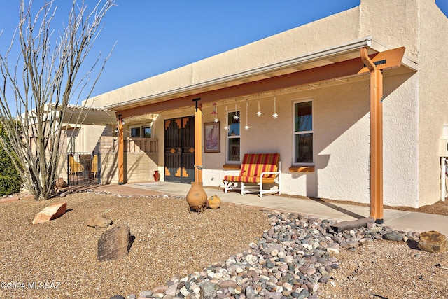 back of property featuring a patio area