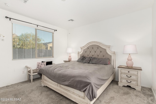 bedroom with light carpet