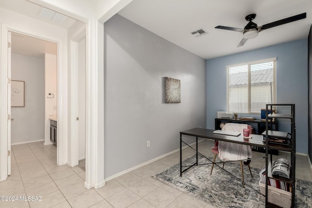 tiled home office featuring ceiling fan