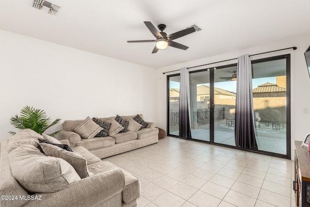 tiled living room with ceiling fan