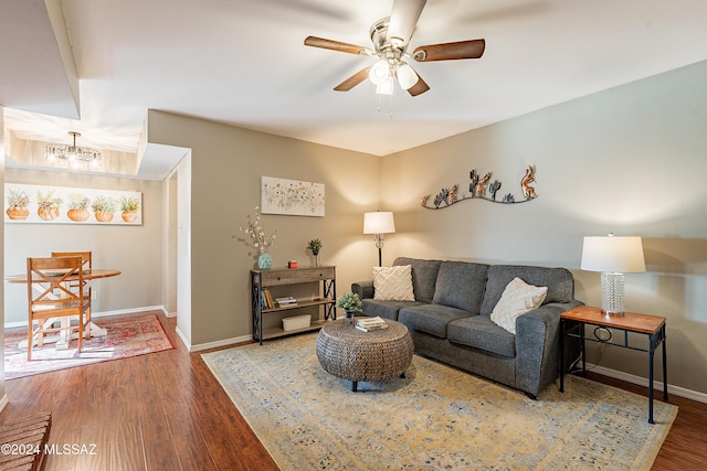 living room with hardwood / wood-style flooring and ceiling fan