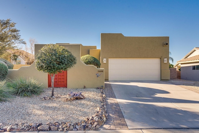 southwest-style home with a garage