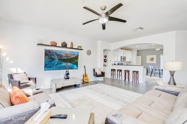 living room featuring ceiling fan