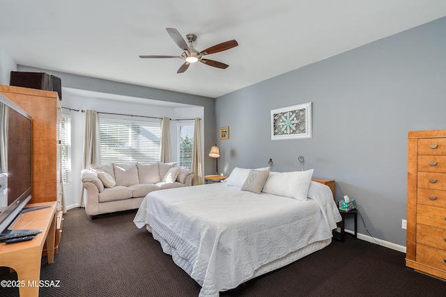 bedroom featuring ceiling fan and dark colored carpet