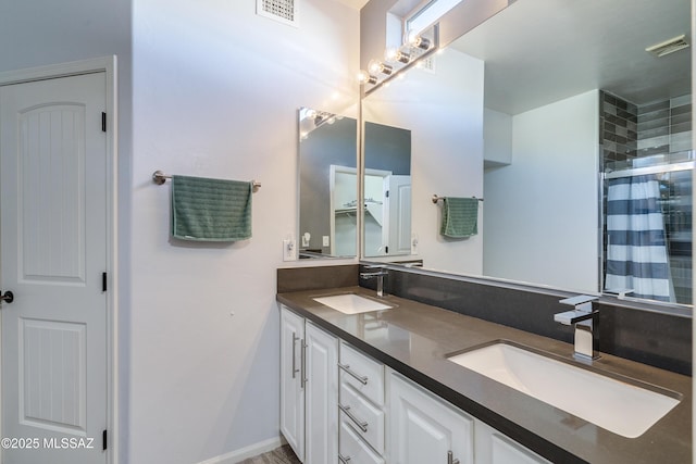 bathroom with a shower with curtain and vanity