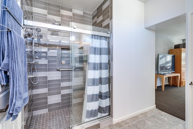 bathroom with tile patterned floors and a shower with shower curtain