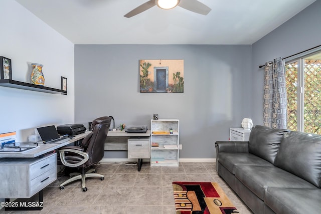 office space with light tile patterned floors and ceiling fan