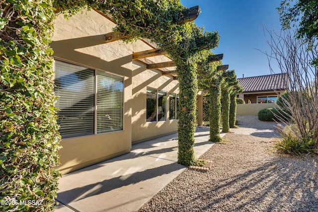 view of property exterior featuring a patio