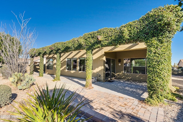 rear view of house featuring a patio