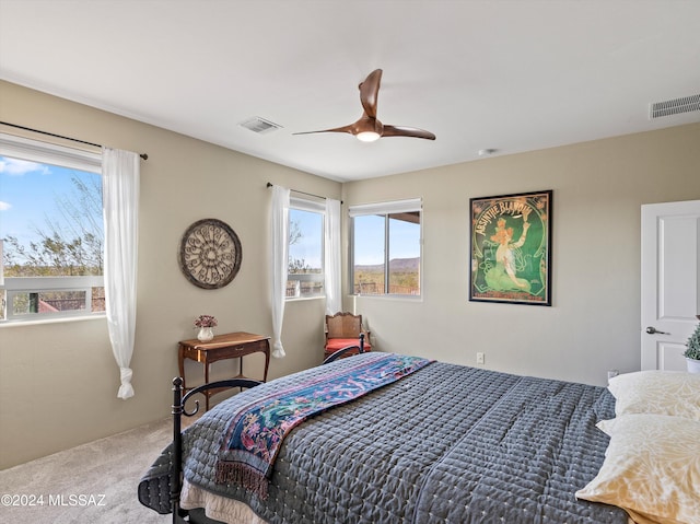 carpeted bedroom featuring ceiling fan