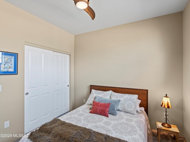 bedroom featuring ceiling fan and a closet