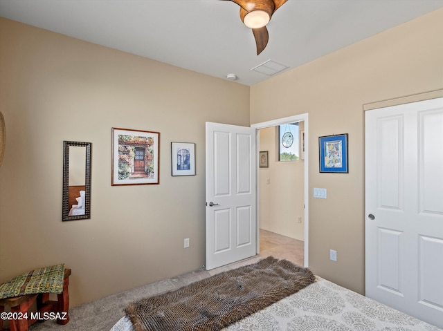 bedroom with light carpet and ceiling fan