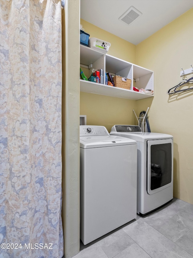 washroom featuring separate washer and dryer