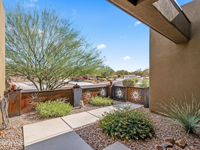 exterior space with fence and a gate