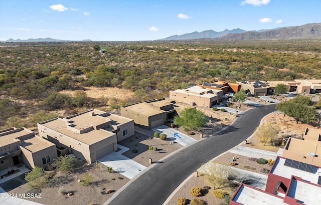 birds eye view of property with a mountain view