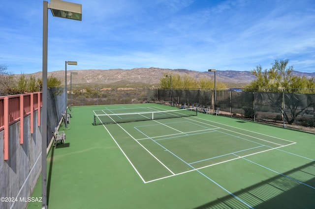 view of sport court with a mountain view