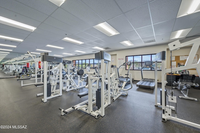 exercise room featuring a paneled ceiling