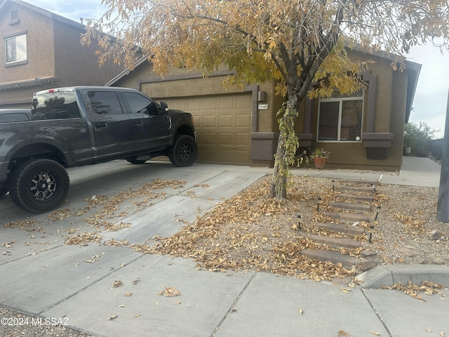 view of side of property featuring a garage