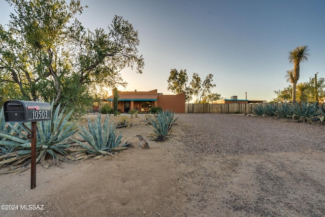 view of yard at dusk