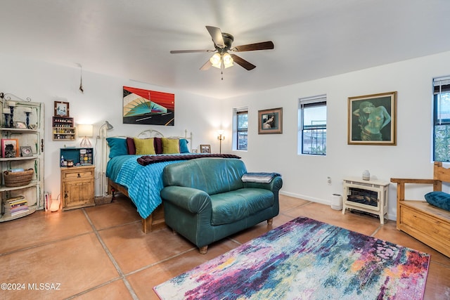 bedroom featuring tile patterned floors and ceiling fan