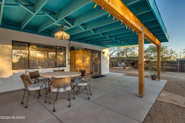 view of patio with fence and outdoor dining area