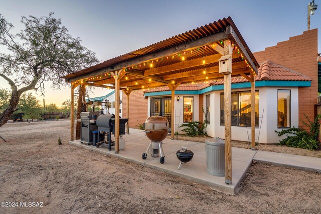 view of patio terrace at dusk