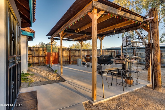 view of patio / terrace with fence and area for grilling