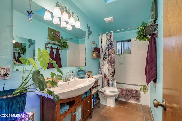 full bath with visible vents, vanity, toilet, and shower / tub combo with curtain