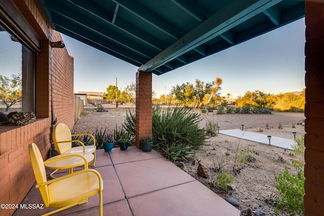 view of patio / terrace featuring fence