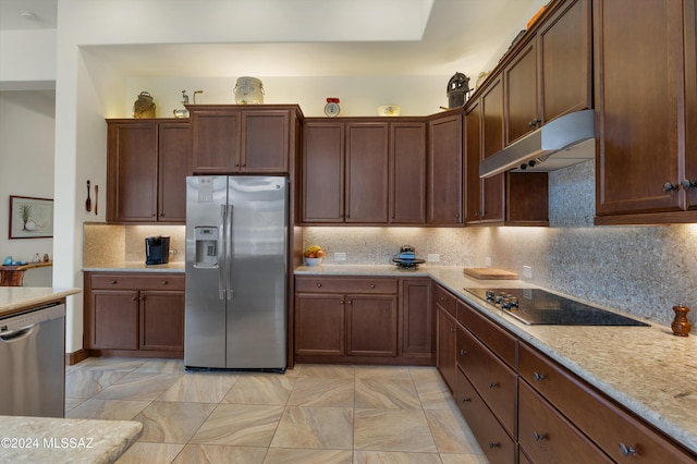 36513 S Cactus Ln, Tucson, AZ 85739 - kitchen with backsplash, light stone counters, appliances with stainless steel finishes, and under cabinet range hood