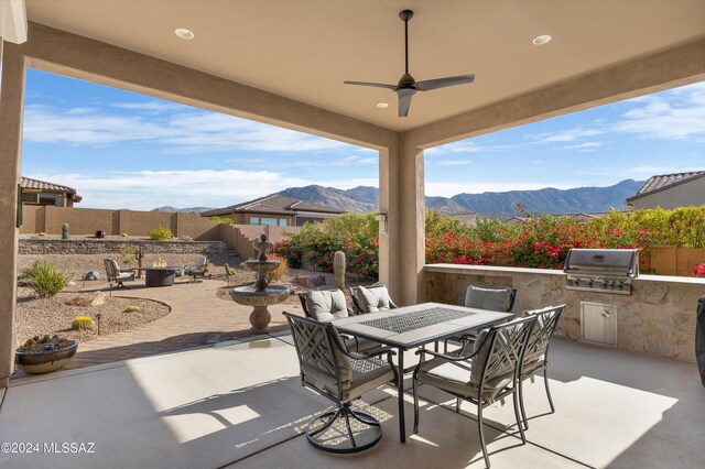 home office featuring ceiling fan and light colored carpet