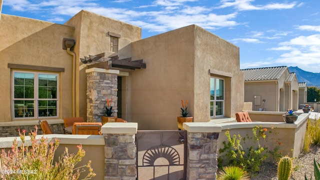 back of house with a mountain view