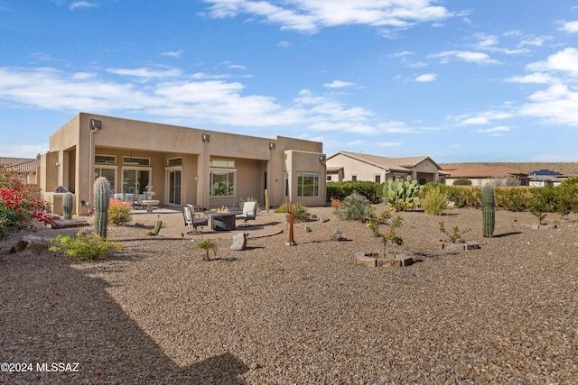 36513 S Cactus Ln, Tucson, AZ 85739 - rear view of house with stucco siding and a patio area