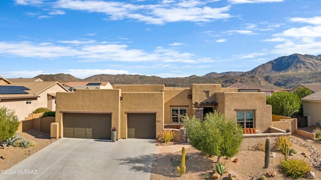 36513 S Cactus Ln, Tucson, AZ 85739 - southwest-style home with stucco siding, fence, a mountain view, concrete driveway, and an attached garage