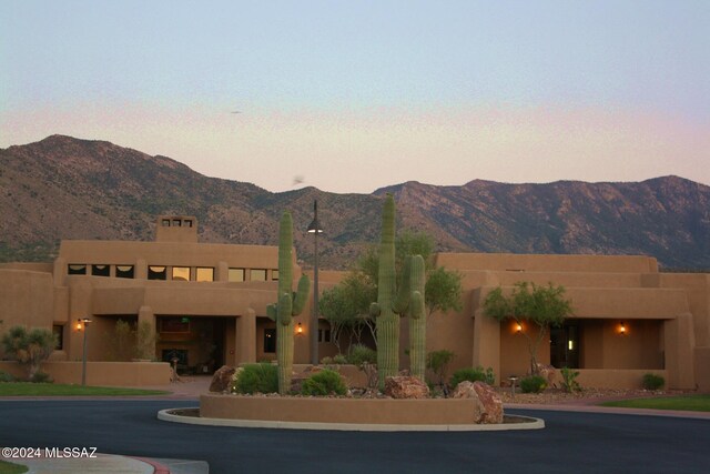 southwest-style home featuring a mountain view and a garage