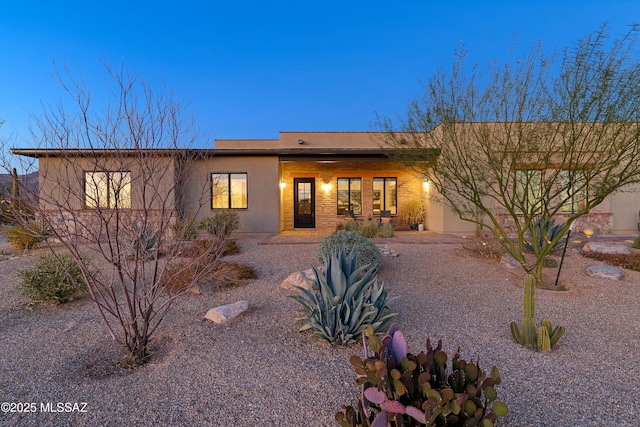 view of front of home featuring stucco siding