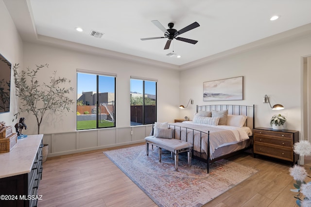 bedroom with light wood-type flooring and ceiling fan