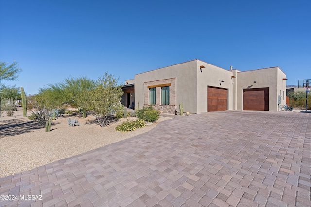 adobe home featuring a garage