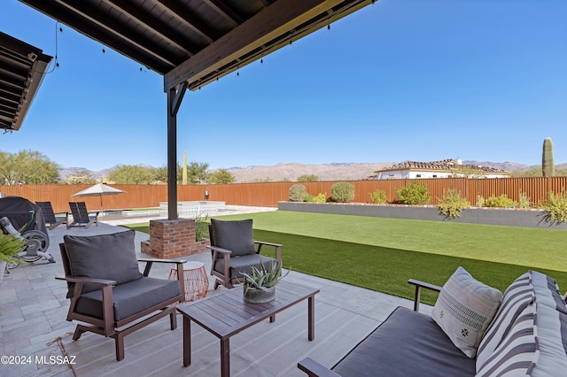 view of patio / terrace featuring outdoor lounge area and a mountain view