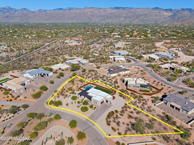 drone / aerial view featuring a residential view and a mountain view